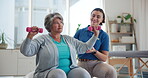 Physiotherapy, dumbbell and health with old woman in clinic for consulting, weights or fitness. Coaching, physical therapy and healing with patient in office for rehabilitation, help or support
