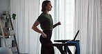 Fitness, woman and running on treadmill in home for cardio exercise, wellness challenge and burning calories. Morning routine, athlete and workout on machine for weight loss, healthy body or training