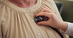 Person, hands and nurse with stethoscope for heart rate checkup, breathing or examination in home. Chest closeup, patient and doctor with medical tool for listening, blood pressure or cardiac exam