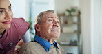 Woman, caregiver and person with disability, nursing home or senior care for patient in wheelchair. Healthcare, medical professional and helpful for rehabilitation in clinic, nurse or assisted living