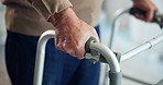 Hands, walking frame and elderly person with balance, steps and recovery process for injury in retirement. Patient, mobility aid and rehabilitation for senior man with disability at nursing home