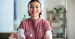 Woman, arms crossed and face in nursing home for healthcare, volunteer and confidence in living room. Nurse person, smile and portrait in clinic for medical support and trust if caregiver office