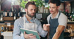 Waiter, tablet and men in coffee shop talking for planning, discussion and training in cafe. Small business, restaurant and barista with manager on digital tech for inventory, menu and online orders
