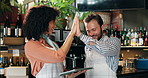 Tablet, celebration and high five with people in cafe for inventory checklist, restaurant management and small business. Customer experience, team and menu rating with man, woman and coffee shop