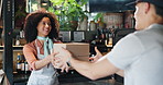 Cafe, delivery man and woman with boxes, smile and collection of takeaways, waitress and small business. Happy, people and distribution for online order in coffee shop, colleagues or customer service