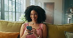 African woman, phone and happy on sofa, texting and meme for notification, contact or online dating. Person, smartphone and smile with laugh, chat and mobile app for social media in lounge at house
