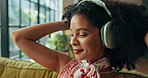 Headphones, audio and happy woman dance in home, streaming sound or playlist subscription on weekend. Living room, music and African person listening to favorite song, radio and hip hop with energy