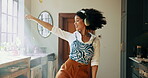 Headphones, dance and happy woman in apartment with music for wellness, radio and streaming. Student, dancer and fun girl with audio playlist in lounge, home or house for celebration or rhythm