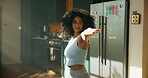 Pilates, woman and stretching in kitchen for fitness, wellness and balance for holistic exercise. Yoga, girl or relax in warrior pose for peace, calm and muscle tension relief with warm up in home
