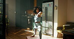 Yoga, woman and stretching in kitchen for fitness, wellness and balance for holistic exercise. Pilates, girl or relax in warrior pose for peace, calm and muscle tension relief with warm up in home