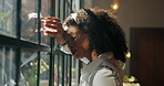 African woman, window and sad in home with headache, mistake and regret with reflection for decision. Person, depressed and thinking for perspective, loss and grief with mental health at apartment