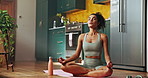 Woman, yoga and lotus on floor, house and breathing with meditation, wellness and peace in kitchen. Girl, mindfulness and exercise mat for mental health, chakra and balance in morning at apartment