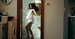 Woman, brush and singing with smile by bathroom mirror, concert and playful with voice, sound and morning in home. Person, hair care and smile with karaoke, song and funny performance at apartment