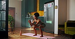 Woman, exercise and squat with fitness, home or balance with growth for leg muscle in kitchen. Girl, workout and training with challenge, stretching and development for glutes in morning at apartment
