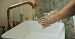 Hygiene, person and washing hands with soap in bathroom for germ removal, disinfection and cleanliness. Closeup, water and cleaning dirt in sink for bacteria safety, healthcare and wellness in home