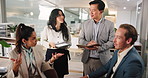 Conversation, laptop and business people in office, meeting and planning for company financial audit. Group, employees or accountant in workplace, cooperation and corporate training with discussion