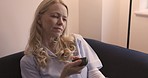 Bored, video and tv with a woman looking for something to watch while sitting in the living room of her home alone. Television, streaming and subscription service with a female watching tv in a house