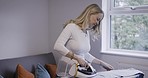 Home, laundry and woman iron clothes, use electrical house appliances and does domestic housekeeping. Cleaning fresh fabric, cleaner or household maid working in living room with steam ironing board