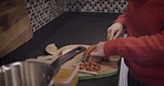 Mature woman, cooking in kitchen and cutting board food, lunch meal and home dinner. Lady chef in house chop ingredients with knife on chopping board for healthy eating, recipe and nutrition at stove