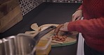 Food, cooking and kitchen with a woman cutting sausage with a knife while preparing a meal in her home. Diet, nutrition and protein with a female chef making supper or dinner in her house alone