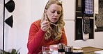 Woman, thinking and eating soup with spoon while hungry for healthy, warm comfort food on vegan diet at lunch. Health, nutrition and dinner time for female with healthy lifestyle in russia home