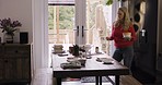 Dance, dining room table and woman cleaning after meal, food or buffet feast at home. Hygiene, working and young cleaner girl with energy dancing while clearing plate after breakfast, brunch or lunch