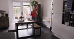 Dance, music and cleaning with a woman cleaner having fun doing housework in a home and singing. Dancing, housekeeping and chores with a homemaker tidying table with energy