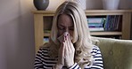 Crying, sad and woman with tissue in home sitting on sofa and blowing her nose. Depression, sadness and lonely middle aged female upset from unhappy marriage, divorce and solitude, alone in her house