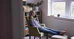 Phone call, communication and relax woman on chair talking, discussion and speaking in home living room. 5g cellular connection, mobile contact and chat conversation for person with digital cellphone