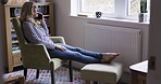 Phone call, talking and middle aged woman on sofa looking out window at home. Online, communication and female relaxing on couch having conversation, speaking and chatting on smartphone on weekend
