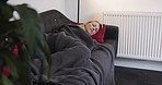 Sleeping, peace and woman asleep on sofa with comfortable pillow, blanket and nap to relax in home living room. Mature woman, tired and fatigue lying eyes on a couch while resting, dreaming and cozy