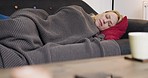 Sleep, blanket and woman on sofa in living room home resting after a long day of work. Relax, tired and female from Canada sleeping on couch in lounge, sweet dreams or nap on weekend in house alone.
