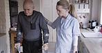 Healthcare, worker and elderly patient learning to walk with disability, parkinson and stroke recovery in home. Physical therapy, walking and woman support, trust and mobility control with senior man