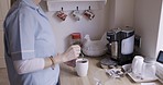 Hands, nurse and tea or coffee in kitchen of retirement home, house or medical clinic in lunch break. Healthcare worker, woman employee or caregiver making drink in the morning