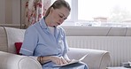 Homecare woman, reading paper documents on living room sofa for medical information or health insurance. Cleaner, contract or paperwork for data results page, sitting in house on lounge couch at job