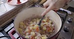 Hands, food and top view of cooking on stove and mixing ingredients in home kitchen. Fine dining, nutritionist and chef preparing delicious, gourmet and healthy meal for diet, wellness and nutrition.