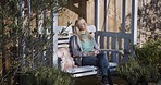 Relax, swing and coffee with a woman on a bench outdoor on a summer day while on holiday or vacation. Garden, nature and rest with a female sitting alone in a yard for some peace, quiet and calm