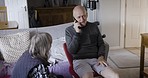 Phone call, physiotherapy and rehabilitation with a senior man talking from a sofa in the living room of a retirement home. Wellness, health and recovery with a male pensioner chatting on his mobile