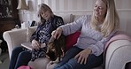 Women, pet cat and relax on sofa together for love, support and animal care in family home. Kitten, loving quality time and animal care or pets enjoying happiness with owners on living room couch