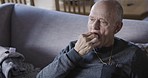 Disability, healthcare and senior man with pills and drink in living room of nursing home or apartment. Medicine, rehabilitation in retirement and grandpa taking medication for chronic pain at home.