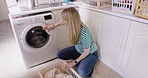 Laundry, machine and woman cleaning in home with basket for hygiene, housekeeping and routine. Clean, washing machine and dryer in house of girl with clothes, fabric and cotton towels.


