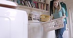 Washing machine, cleaning and woman with laundry basket in home. Hygiene, domestic life and female take out fabric, clothing or linen in dryer or electrical technology after washing for housekeeping.