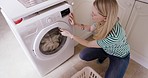 Cleaning, washing machine and woman with laundry basket in home to remove fabric, linen or clothing top view. Housekeeping, hygiene and female take out fresh clothes from electrical dryer technology
