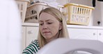 Laundry, cleaning and washing machine with a woman cleaner doing housework or housekeeping for hygiene. Fabric, linen and washing with a female housekeeper unloading an appliance during home chores