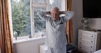 Senior, man and workout for retirement and fitness, health and wellness while at home. Morning exercise, fit and mature retired male working out with arm and body exercise in his bedroom 