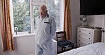 Back stretching, health and senior man in bedroom home for mobility and fitness in the morning. Rehabilitation, wellness and healthy, retired and elderly male stretch in house alone for healthcare.
