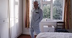 Elderly man, hip rotatation exercise and morning stretching for senior healthcare, mobility training and flexibility workout. Retirement home, health rehabilitation center and old man with back pain 