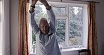 Elderly man, stretching and exercise in bedroom of retirement home for a morning fitness routine, back health and indoor spine stretch. Senior in pajamas, physical rehabilitation and healthy retired 