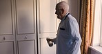Senior rehabilitation, arm weights and fitness of a man in retirement nursing home with care. Health, workout and mobility training of a elderly person at home exercise cardio for health and wellness
