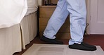 Senior man, bed and slippers for walk, start and morning in home in pajamas on carpet in retirement. Elderly gentleman, comfort and orthopedic shoes for easy walking in bedroom, apartment and house